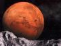 01 Jan 2000 --- NASA image of the planet Mars, featuring Valles Marineris, with a computer generated image of the surface of a moon in the foreground. --- Image by © Denis Scott/CORBIS
